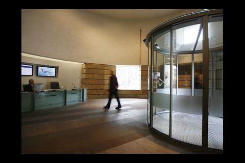 The formerly windswept entrance drum has gained glass doors and a reception desk